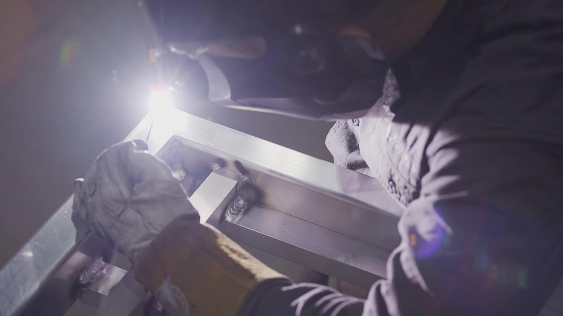 Welding an aluminium tray frame in the FAB CARTEL workshop