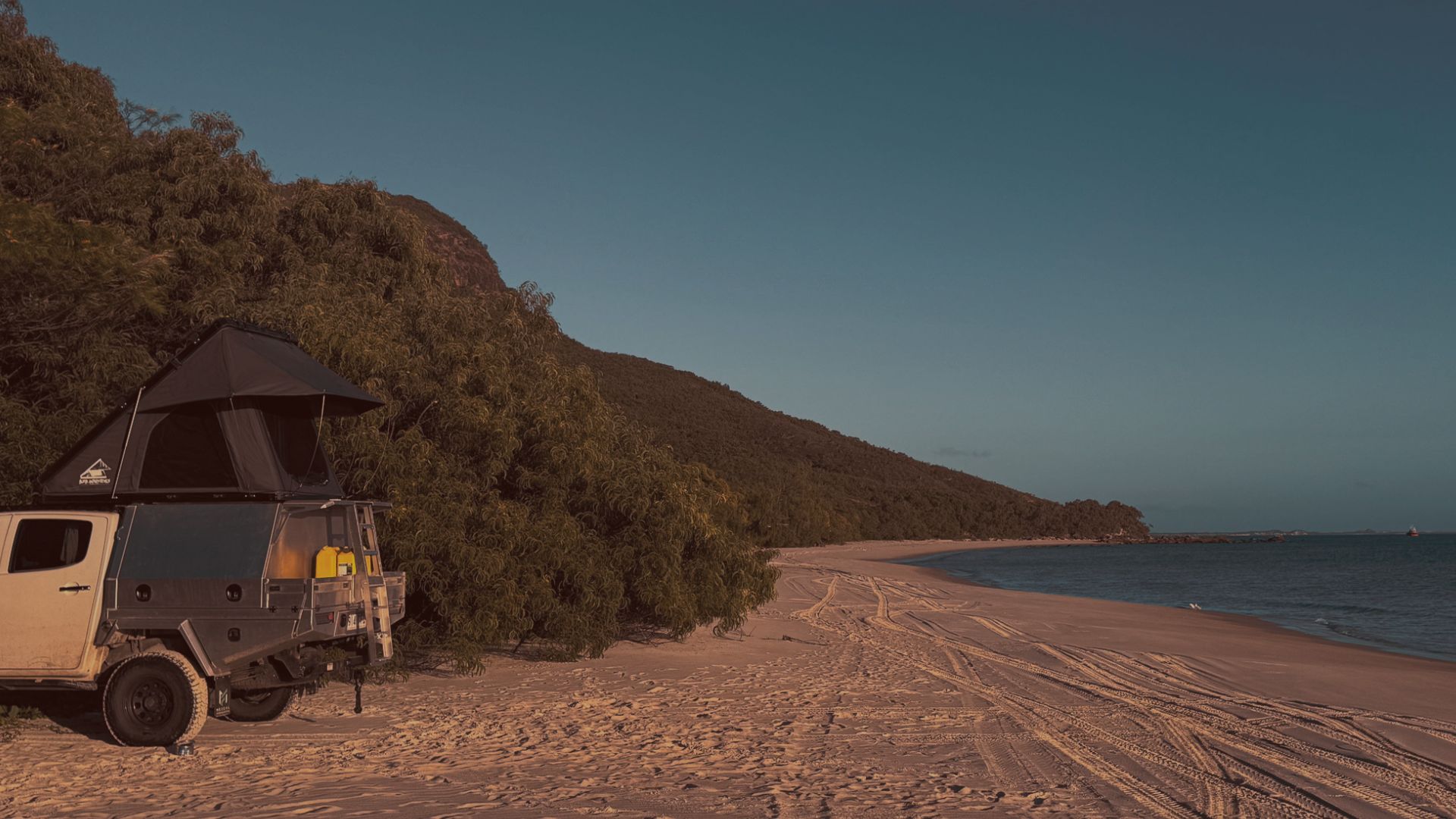 Fab Cartel ute with rooftop tent camped on a remote Australian beach
